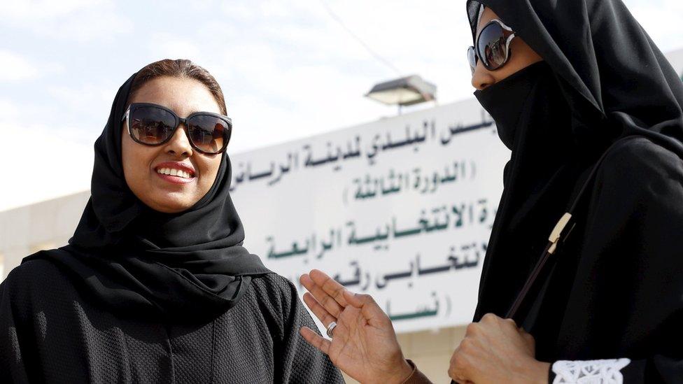 Saudi women leave a polling station after casting their vote in Riyadh