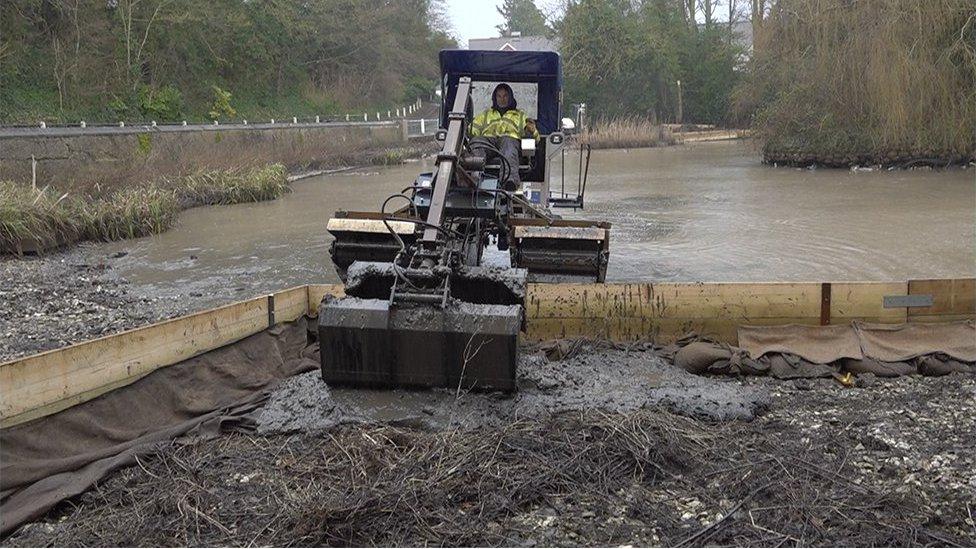 Dredging of the pond