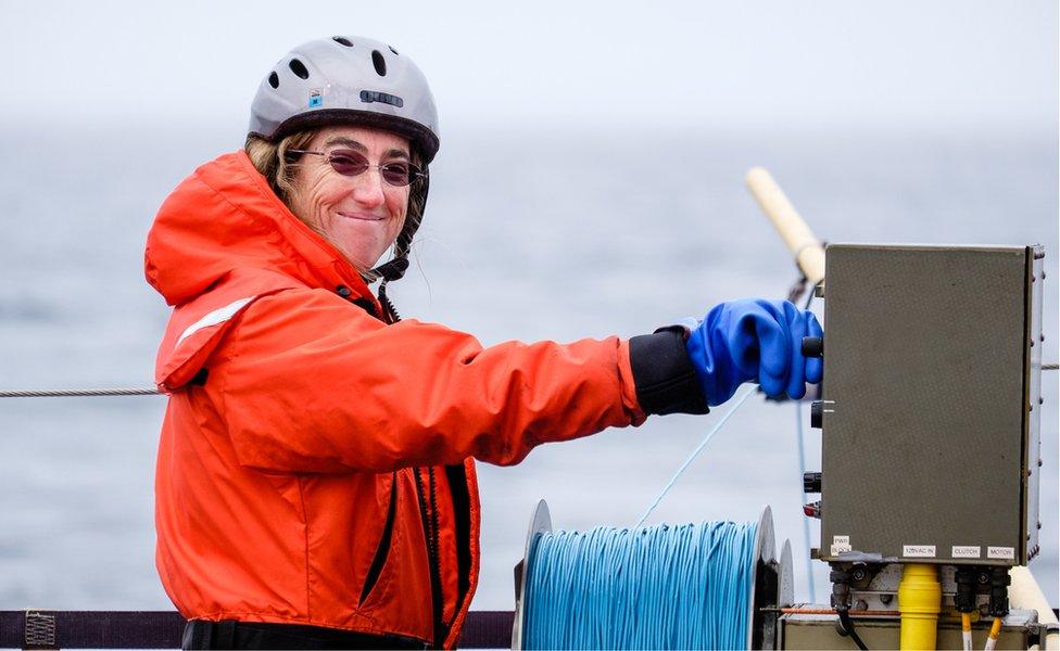 scientist winding a winch