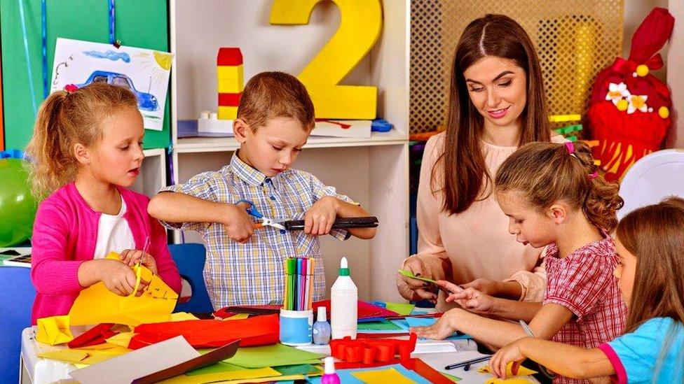 Nursery children with teacher