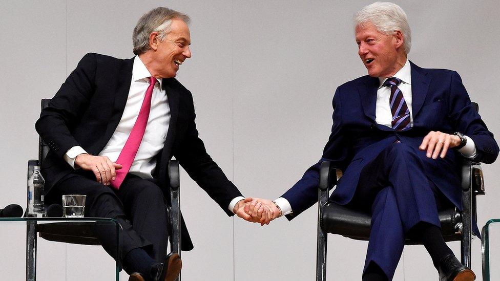 Tony Blair and Bill Clinton shake hands