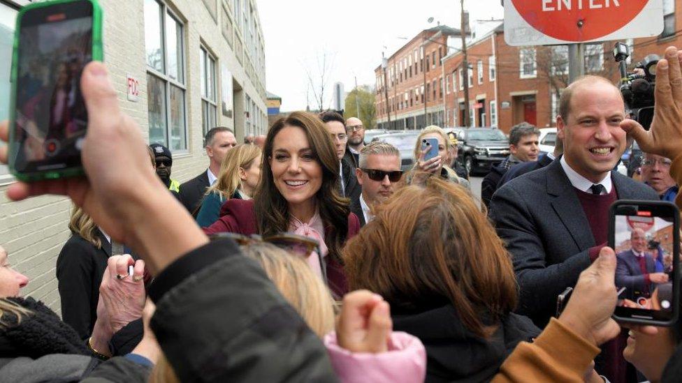 Britain's Prince William and Catherine, Princess of Wales, interact with people during their visit to Roca, a non-profit organisation