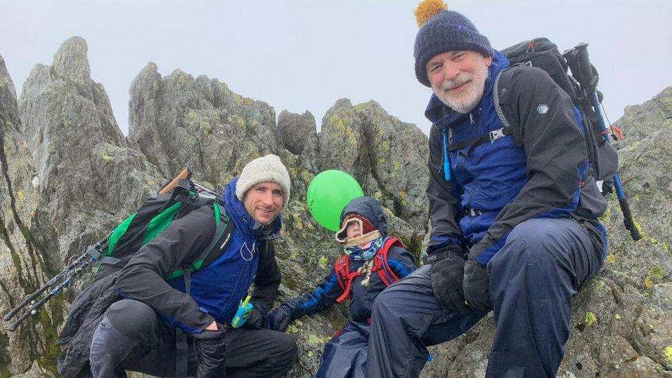 Oscar Burrow (centre), with his father Matt Burrow (left) and his grandfather Mark Burrow