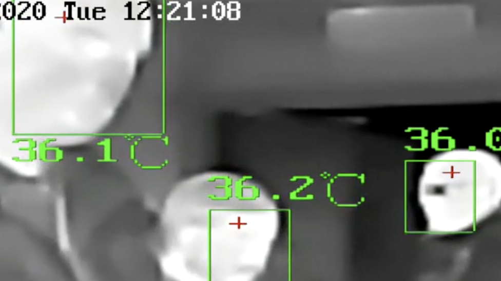 An image from a thermal camera showing travellers' temperatures