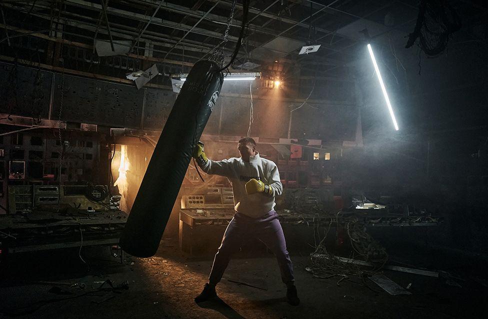 Ukrainian heavyweight champion Oleksandr Usyk hits a punch bag as he visits an energy plant in Central Ukraine to hear stories of survival and resilience from frontline workers on 17 March.