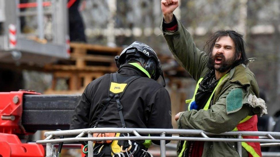 Police arrest a protester