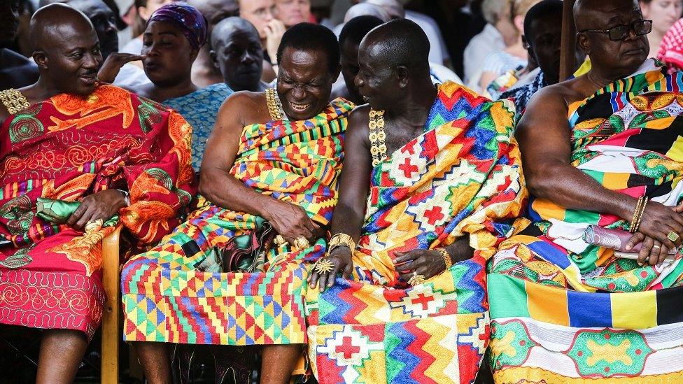 Tribal chiefs laugh during a visit of Britain's Prince Charles, Prince of Wales and his wife Britain's Camilla, Duchess of Cornwall to Osei Tutu II, the Asantahene or king of Ghana's Asante people, at Manhyia palace in Kumasi, Ghana on November 4, 2018