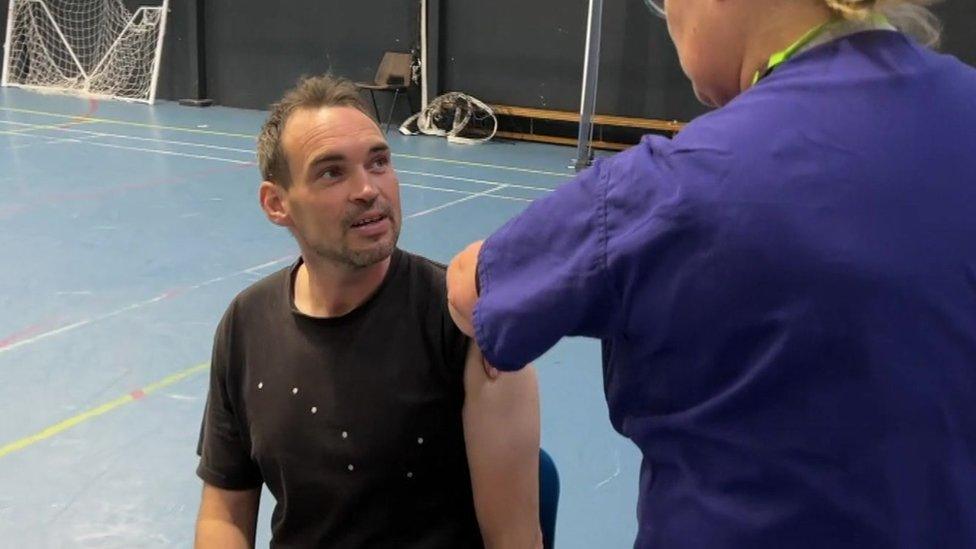 Big Issue seller Joe gets his Covid jab in Bournemouth pop-up clinic for the homeless