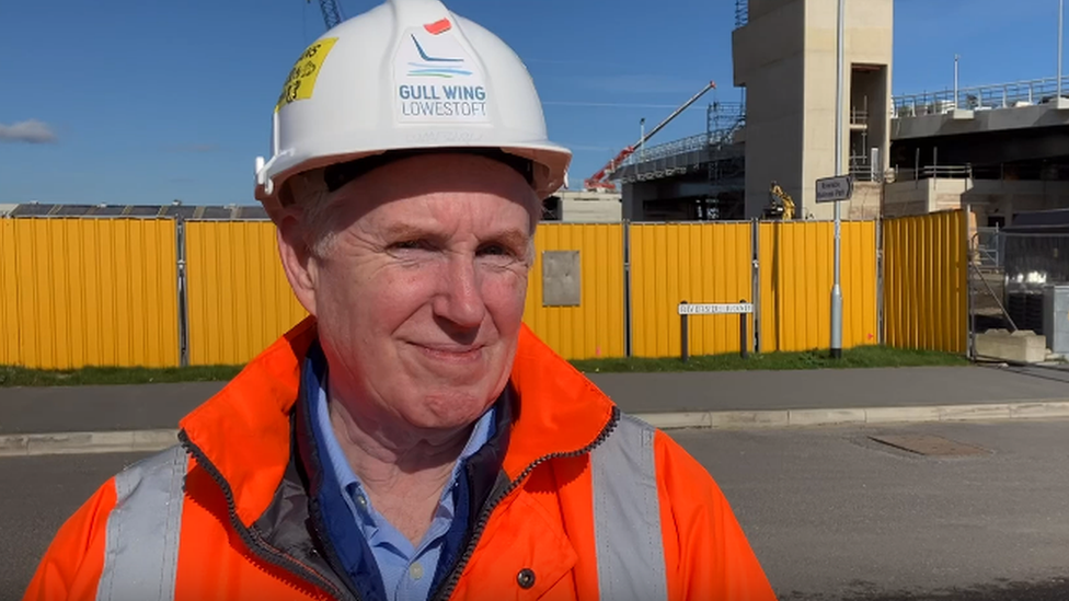 Simon Bretherton, project manager at Suffok County Council, wearing an orange high vis jacket and hard hat