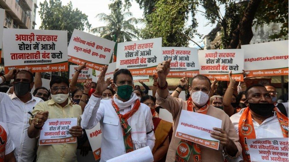 Activists of Bharatiya Janata Party (BJP) hold placards and shout slogans against the Maharashtra state government during a protest over the arrest of Arnab Goswami, news anchor of Indian television channel, in Mumbai, India, 04 November 2020.