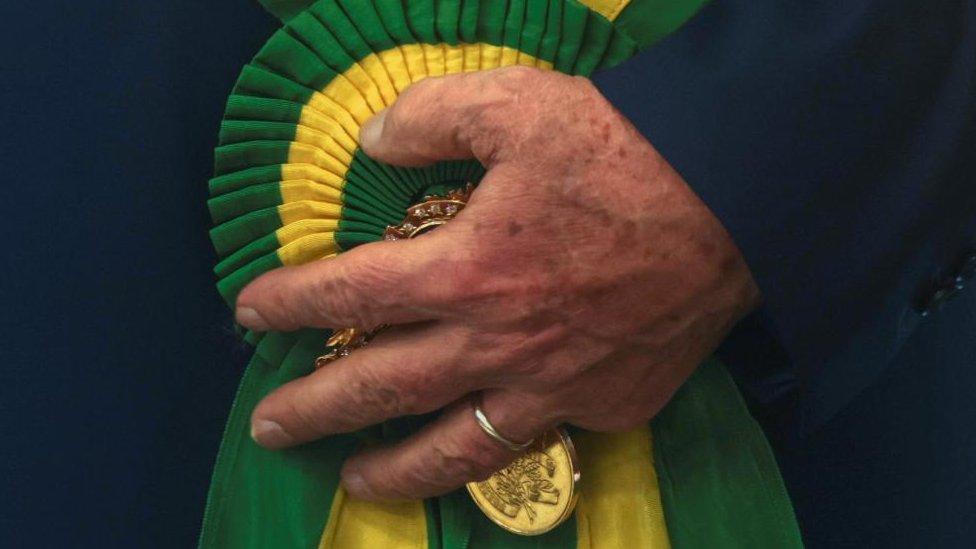 Brazil's President Luiz Inacio Lula da Silva holds the presidential sash, in Brasilia, Brazil, January 1, 2023.