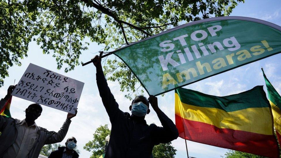 Members of the Ethiopian community hold up signs at the US State Department to protest the ongoing murder and ethnic cleansing of members of the Amhara ethnicity in multiple regions in Ethiopia at the U.S. State Department on May 17, 2021 in Washington, DC.