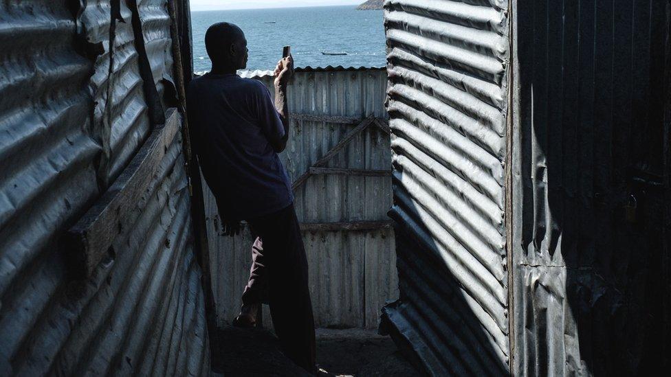 A man using a mobile phone in Kenya