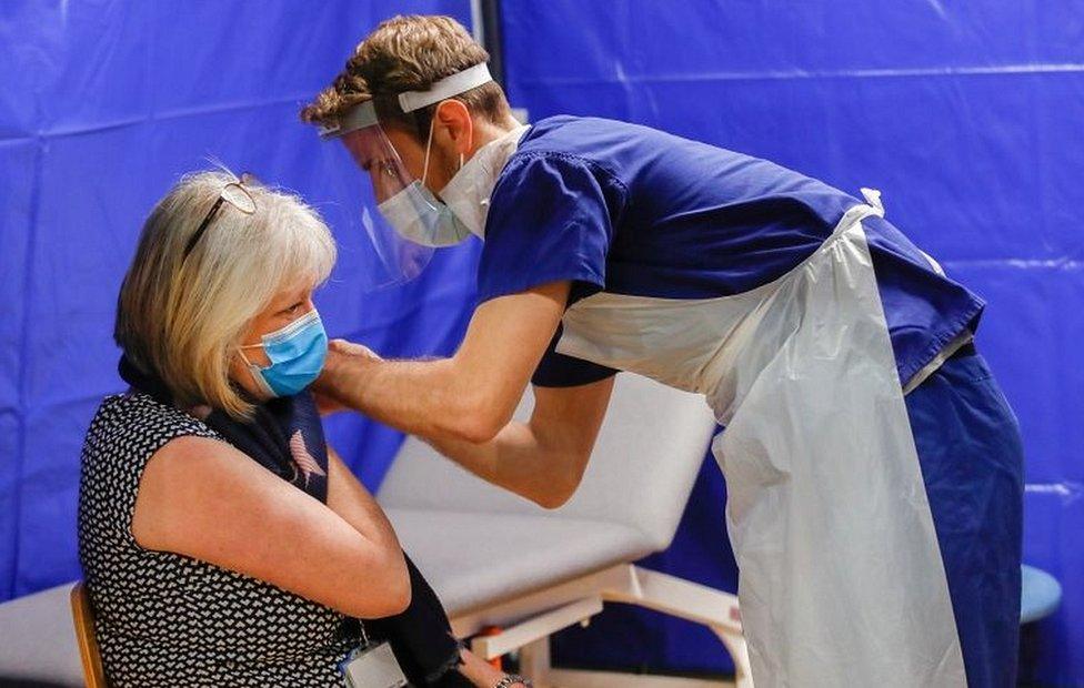 Woman having jab