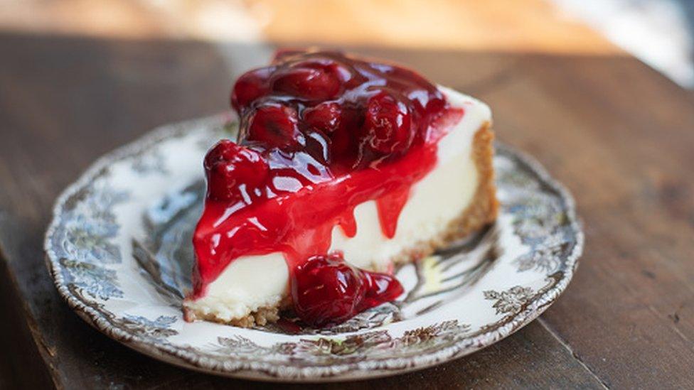 A New York Cheesecake with cherries