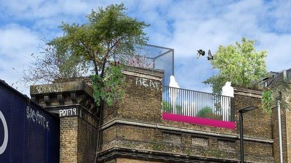 people looking over balcony in Camden