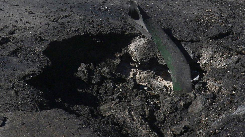 A crater at the site of what activists say was an air strike by Syrian government forces in Khan Sheikhoun, Syria (4 April 2017)