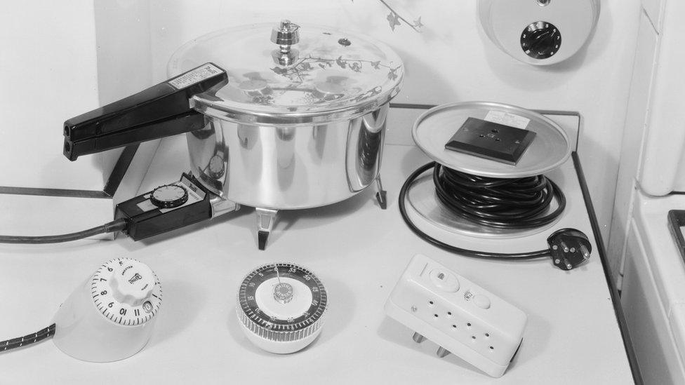 7th October 1959: A pressure cooker, time switch, extension and timer. Modern Woman - pub. 1959