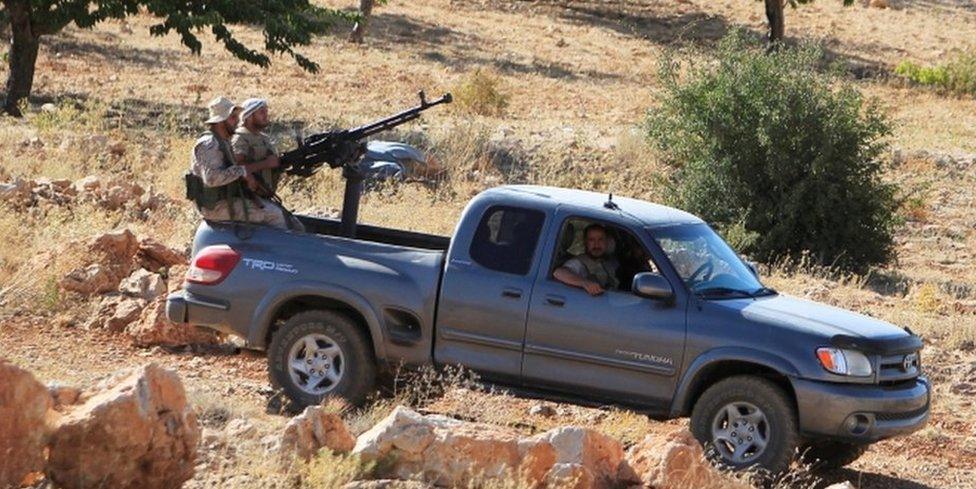 Hezbollah fighters are seen in a truck in Jroud Arsal, near Syria-Lebanon border, August 13, 2017.