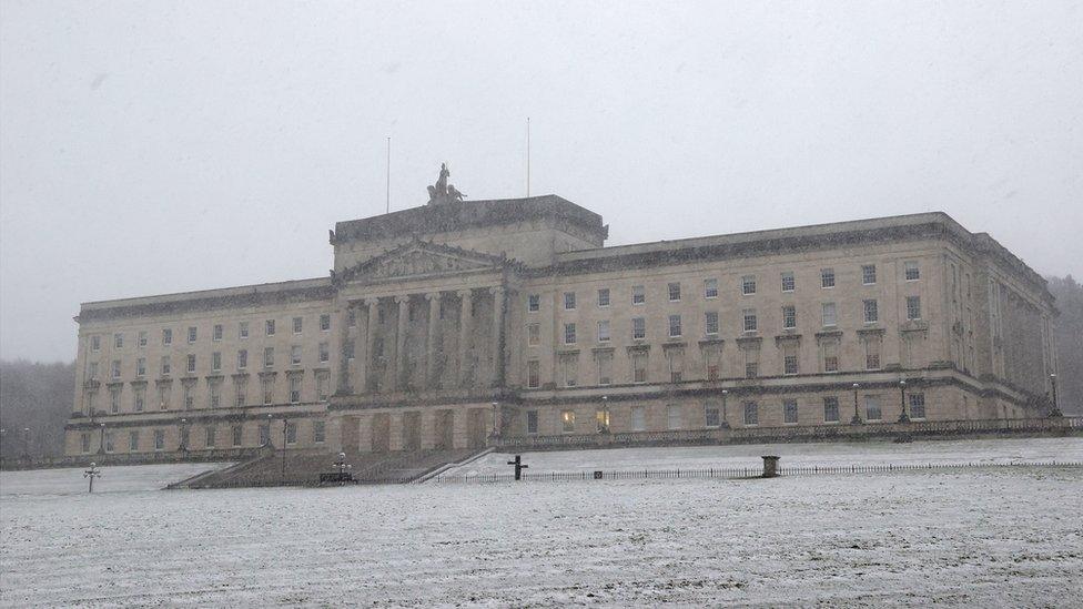 grey skies and snow surrounds Stormont in Northern Ireland.