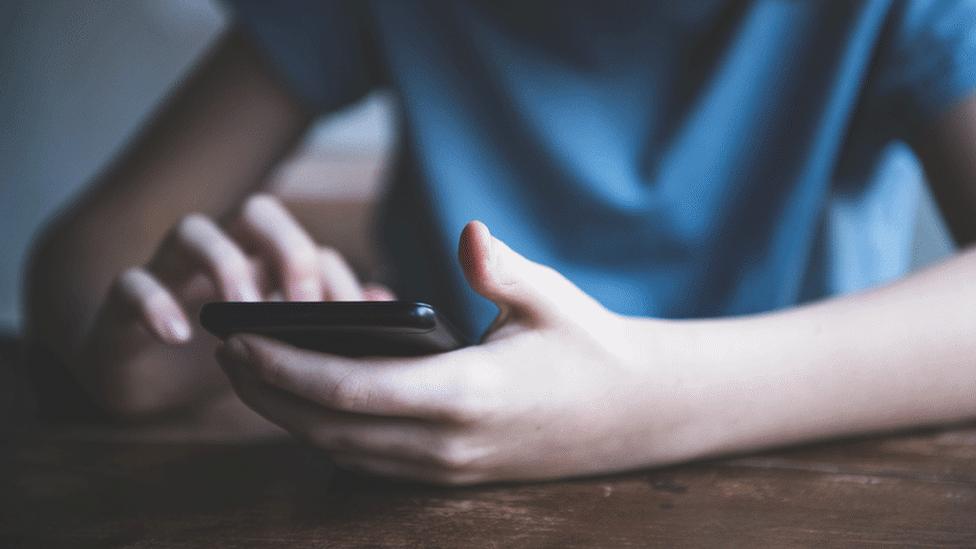 Boy using phone