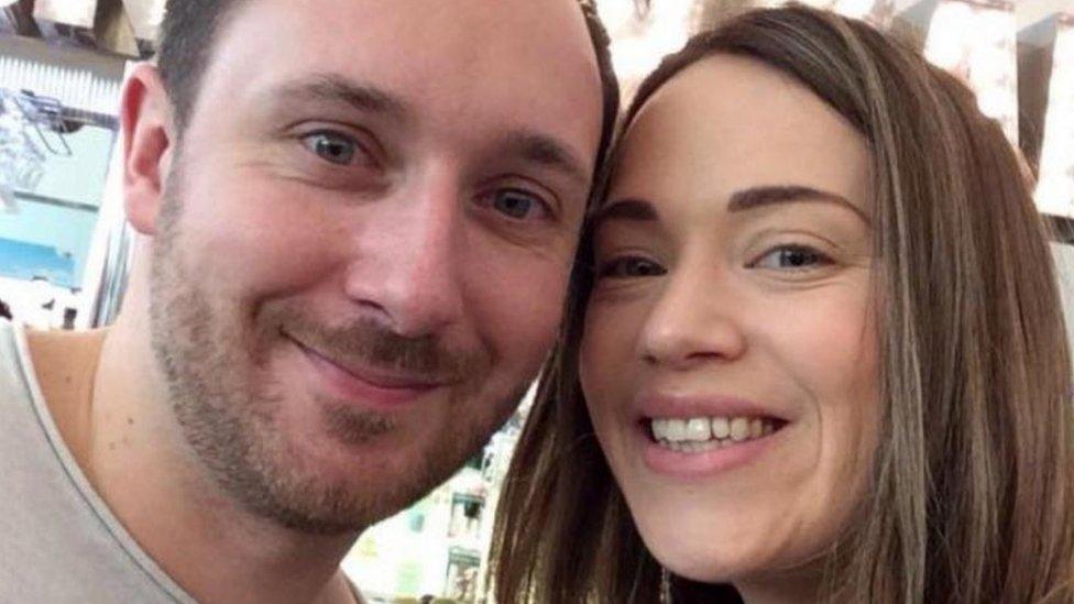 Jonathan Udall and wife Ellie Milward, who both died following a helicopter crash at the Grand Canyon in 2018. They are seen looking at the camera with their heads together.