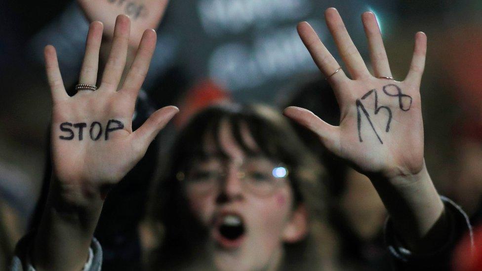 A woman participates in a demonstration to protest against femicides and violence against women, in Nantes, France, 25 November, 2019.