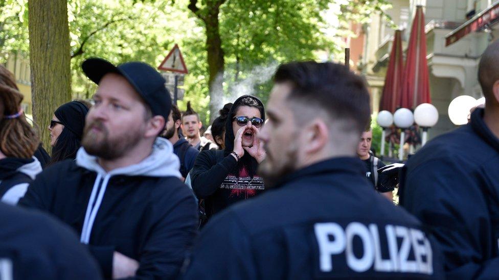 A man shouts slogans to police as a group of counter-demonstrators gathers at an event of the right-wing party "Alternative for Germany" (AfD) in Pankow, Berlin, Germany, 01 May 2018.