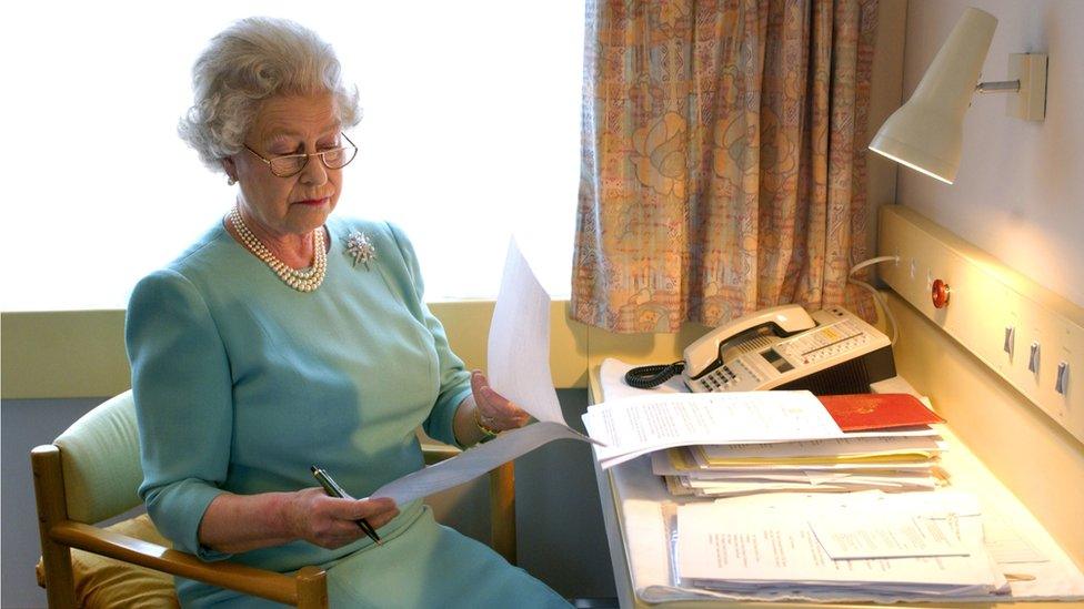 Queen Elizabeth II at work aboard the Royal train near Darlington.