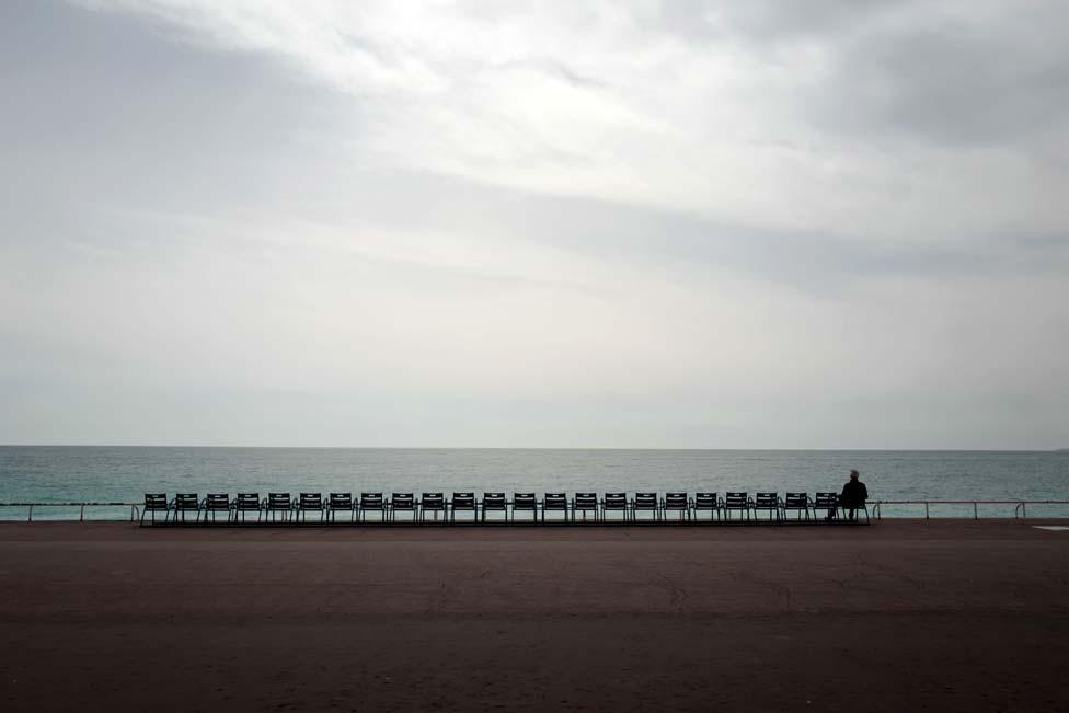 A man looks at the Mediterranean sea