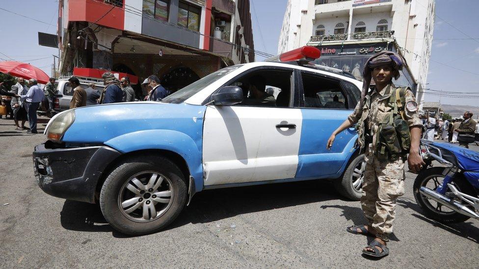 Houthi forces stand guard during a rally in Sanaa, Yemen (6 June 2021)