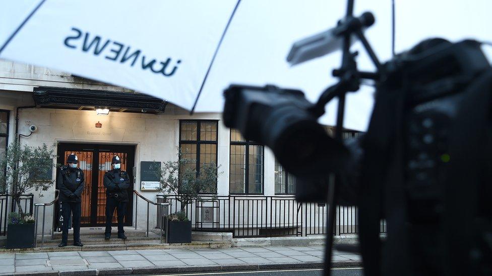 Umbrella with an ITV News logo