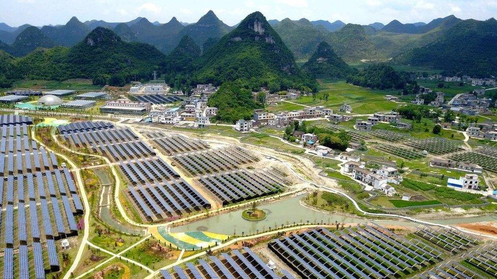 Greenhouses with solar panels on their roofs, in Yang Fang village in Anlong, in China's southwest Guizhou province