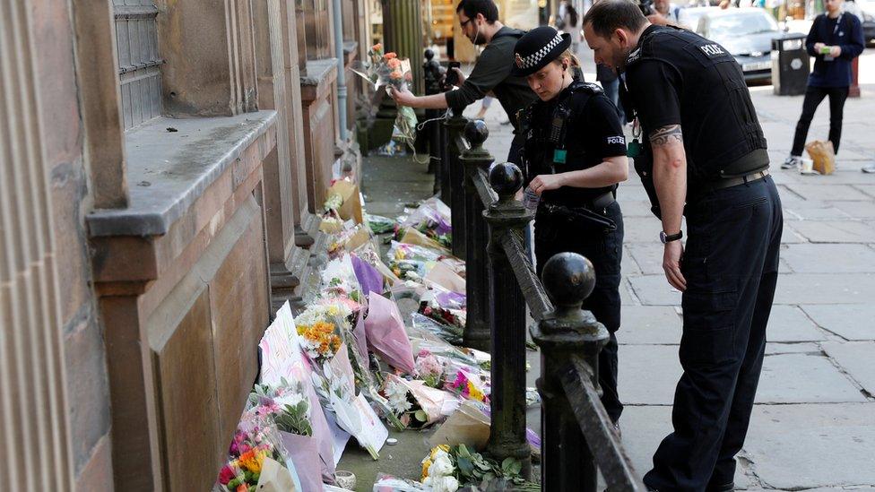 Police with tributes