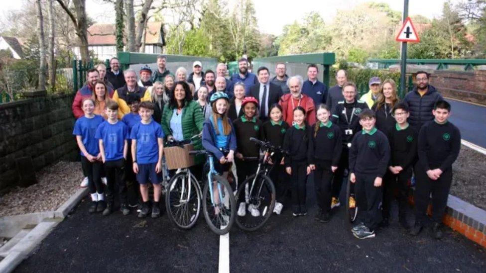 Group photo of council officials and school children marking the opening of the bridges