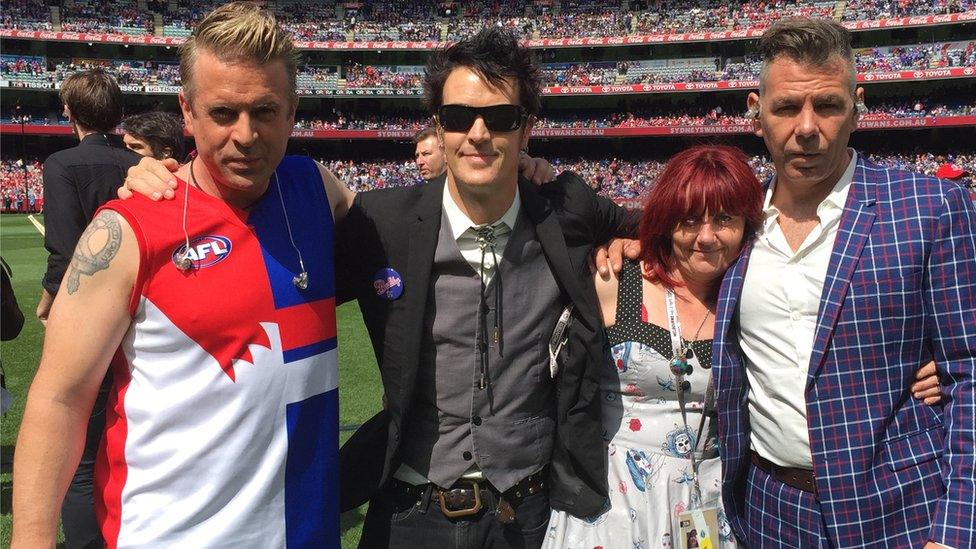 Ms Harvey with The Living End at the MCG in 2016, when the ban performed at the AFL Grand Final