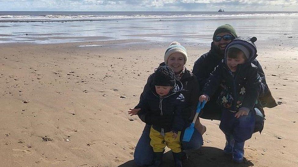 Ben Lightburn (top right) with family on a beach