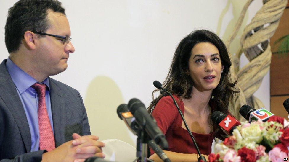 Human rights lawyers Amal Clooney, right, and Jared Genser