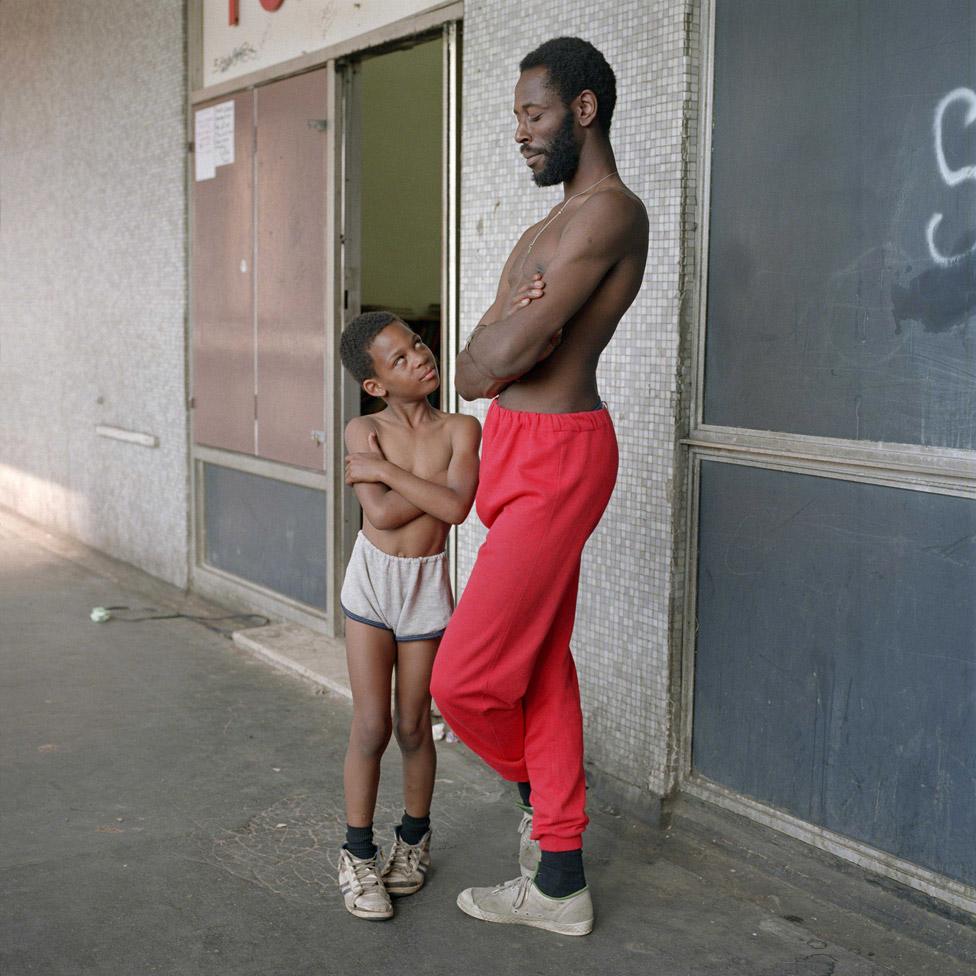 Bill Stephenson: Tony the Ton and Martin age eight, outside the Pop In Centre. Hyde Park Flats, Sheffield, 1988