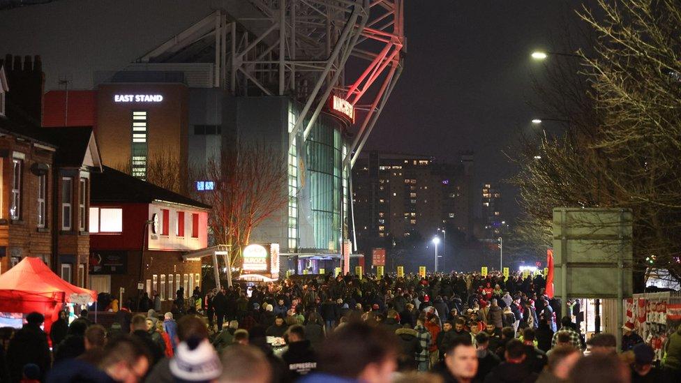 Fans gather outside Old Trafford