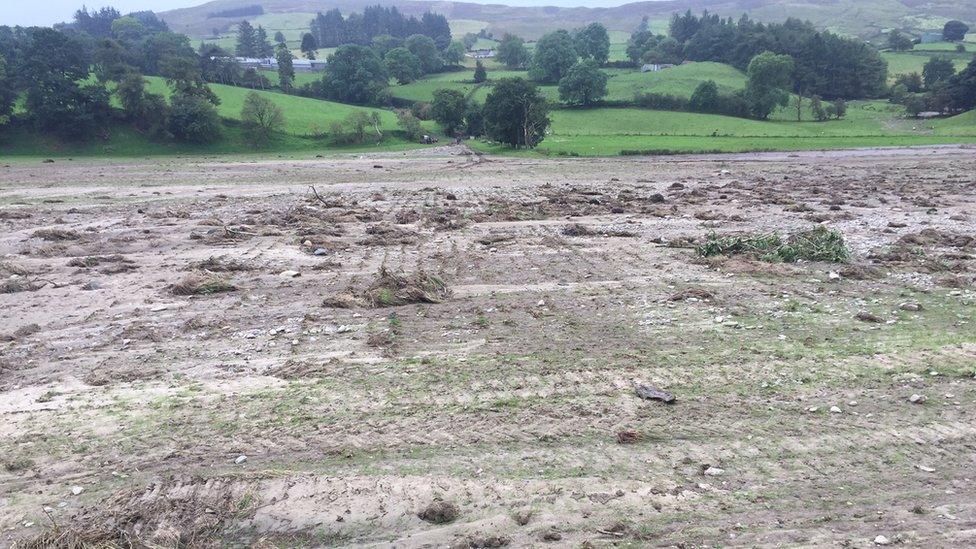 Fertile agriculture land has been covered in thick mud and rubble