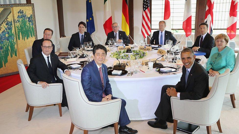 Japanese Prime Minister Shinzo Abe, U.S. President Barack Obama, German Chancellor Angela Merkel, Italian Prime Minister Matteo Renzi, European Council President Donald Tusk, European Commission President Jean-Claude Juncker, Canadian Prime Minister Justin Trudeau, British Prime Minister David Cameron and French President Francois Hollande pose for a photo during a working lunch at a previous G7 meeting