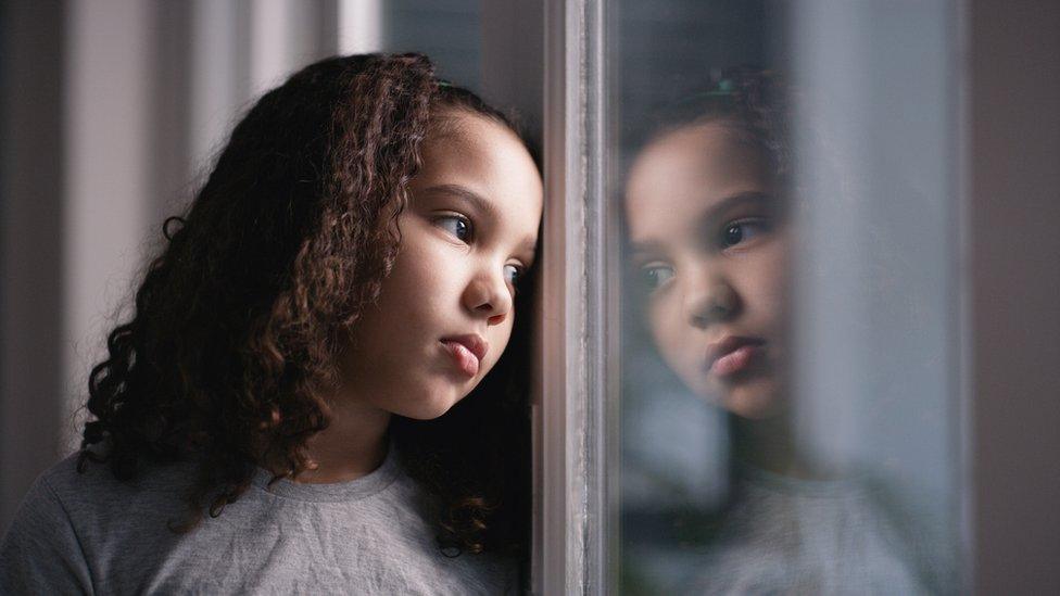 girl-looking-out-of-the-window.