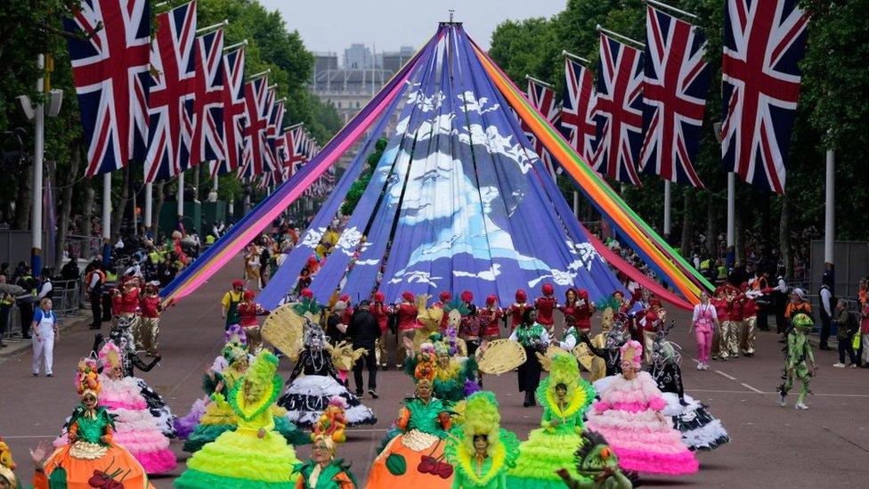 Performers in colourful costumes