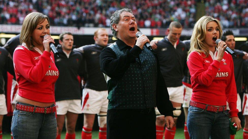 From left to right: Charlotte Church, Max Boyce and Katherine Jenkins perform the Welsh National anthem at the RBS Six Nations International between Wales and Ireland at The Millennium Stadium on 19 March, 2005 in Cardiff