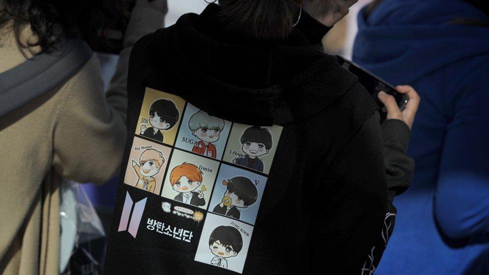 Fan in BTS hoodie