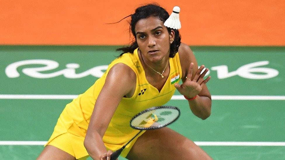 India"s Pusarla V. Sindhu returns against China"s Wang Yihan during their women"s singles quarter-final badminton match at the Riocentro stadium in Rio de Janeiro on August 16, 2016,