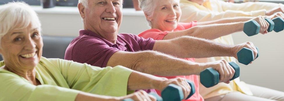 eniors using weights in a retirement home