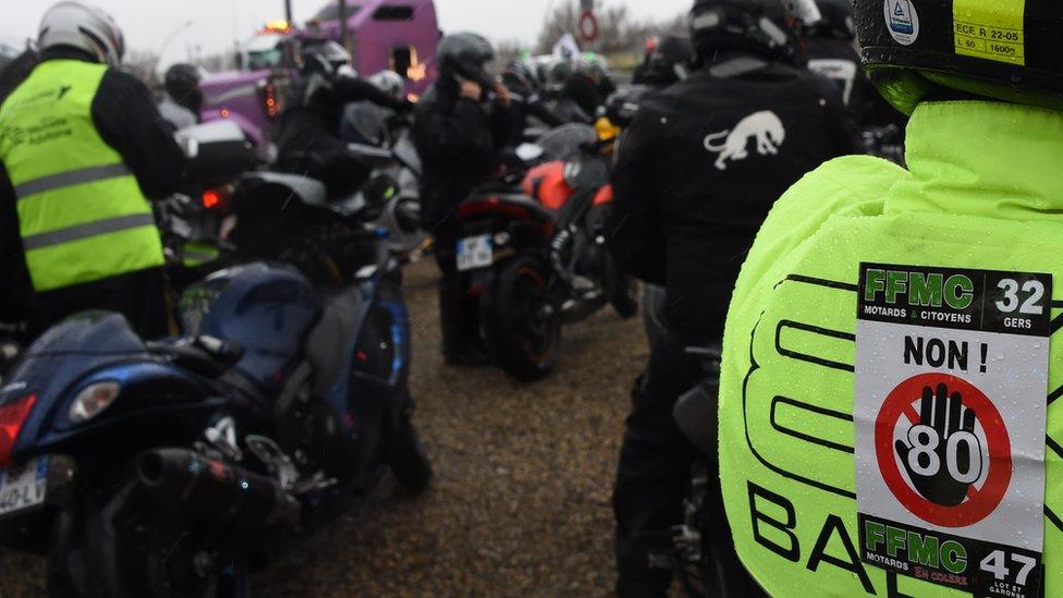 A biker bears a sticker during a demonstration against the 80km/h speed limit in January 2018 in Agen, southern France