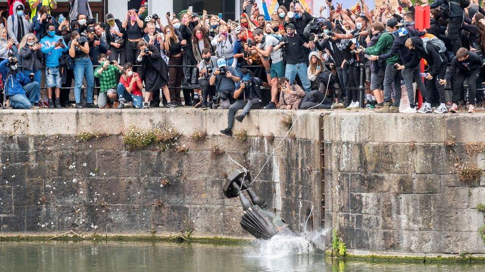 Protesters throw statue of Colston into harbour